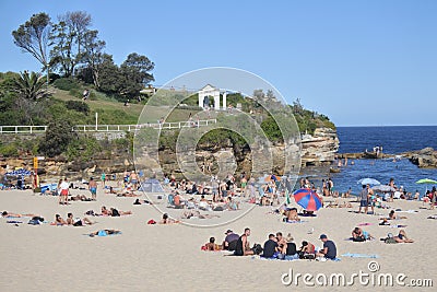Young people relaxing on Coogee Beach in Sydney New South Wales Australia Editorial Stock Photo