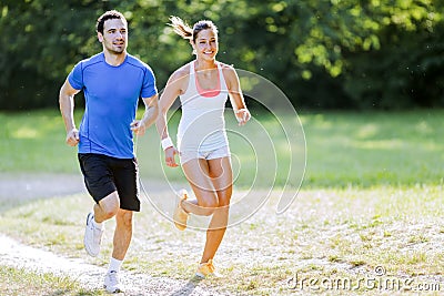 Young people running in nature Stock Photo