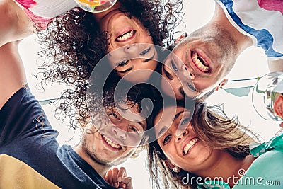 Young people with their heads together having fun Stock Photo