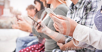 Young people using smart mobile phones - People addiction to new technology trend - Concept of youth, millennial generation, Stock Photo