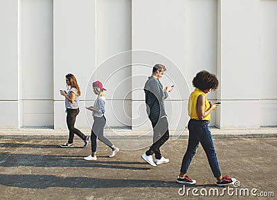 Young people using smartphones outdoors Stock Photo