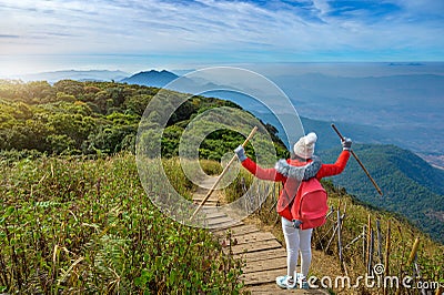 Young people walking on a hilltop in Doi Inthanon, Chiang Mai, Thailand Stock Photo