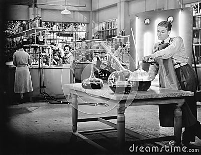 Young people working in a chemistry lab Stock Photo