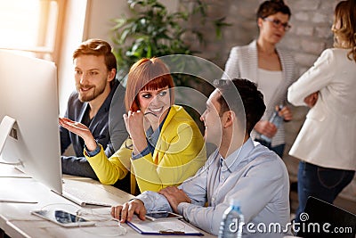 Young people working together on computer Stock Photo