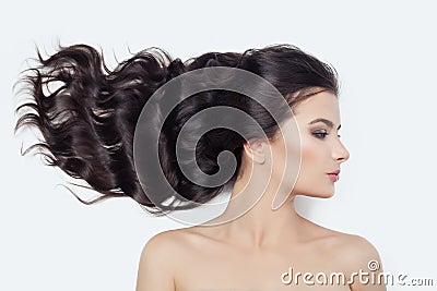 Young perfect female face on white. Cute woman with blowing curly hair, profile Stock Photo