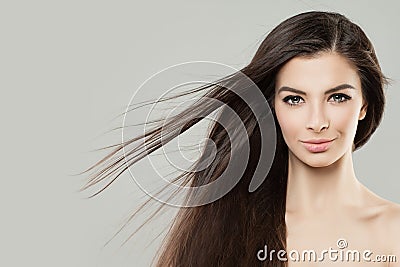 Young Perfect Woman with Blowing Hair. Beauty Female Face Stock Photo