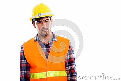 Young Persian man construction worker thinking while looking sad Stock Photo