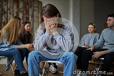 Young person is ashamed to admit that he is addicted to alcohol Stock Photo