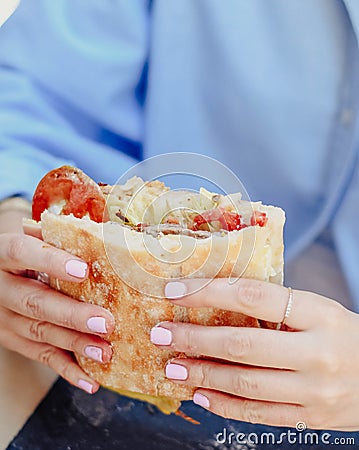 young person enjoying a beef sandwich Stock Photo