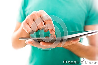 Young person navigating a tablet Stock Photo