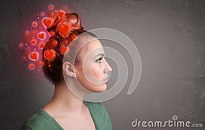 Young person thinking about love with red hearts Stock Photo