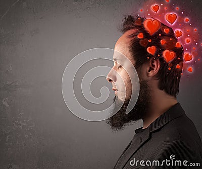 Young person thinking about love with red hearts Stock Photo