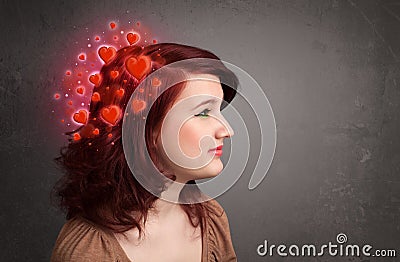 Young person thinking about love with red hearts Stock Photo