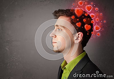 Young person thinking about love with red hearts Stock Photo