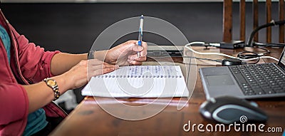 A young person working remotely in a home office Stock Photo