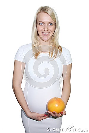 Young Petty Natual Beauty Pregnant Woman Holding Grapefruit and Shows a Belly That Begins to Grow Isolated on White Background. 20 Stock Photo