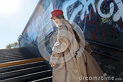 Young photo model working for French magazine wearing red beret Stock Photo