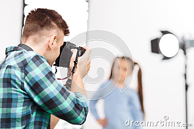 Young photographer is busy during photoshoot Stock Photo