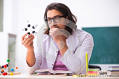Young male physicist in the classroom Stock Photo