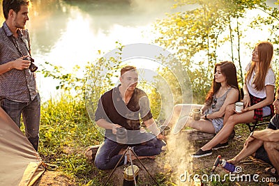 Young pleasant man is telling interesting stories to his friend Stock Photo