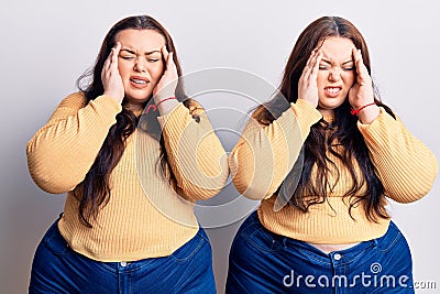 Young plus size twins wearing casual clothes with hand on head, headache because stress Stock Photo