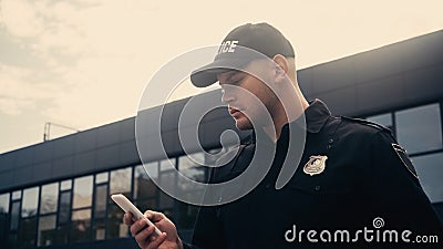 young policeman in uniform with badge Stock Photo