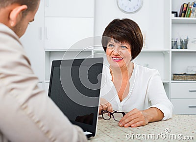 Journalist with laptop interviews the elderly wealthy woman Stock Photo
