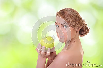 Positive woman with a green apple Stock Photo