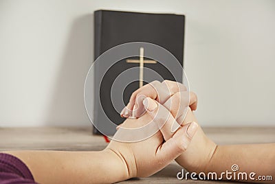 Young prayer woman holding Bible Stock Photo