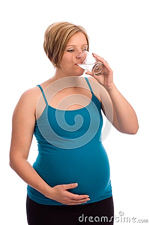 Young pregnant Caucasian woman drinking water Stock Photo