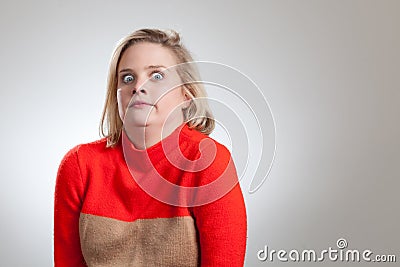 Young Pretty Blonde Making a Weird Face Stock Photo