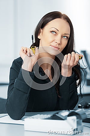 Young pretty business woman with notebook in the office Stock Photo
