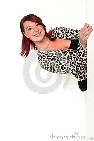 Young pretty business woman peeking around a Stock Photo