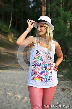 Young pretty casual woman near the forest Stock Photo