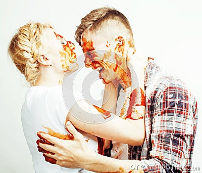 young pretty couple, lifestyle people concept: girlfriend and boyfriend cooking together, having fun, making mess Stock Photo