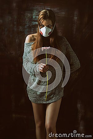 Young pretty female wearing respirator, allergy concept Stock Photo