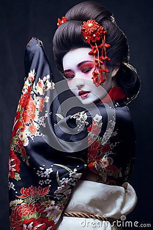 Young pretty geisha in kimono Stock Photo
