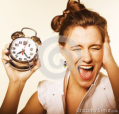 Young pretty girl with alarm clock Stock Photo