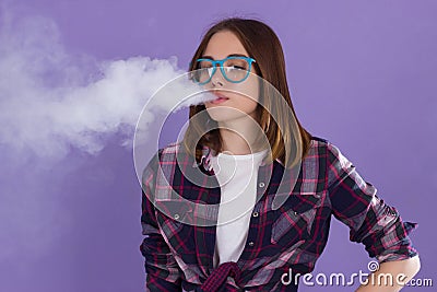 Young pretty girl with electronic cigarette Stock Photo