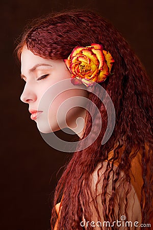 Young pretty girl with a flower Stock Photo