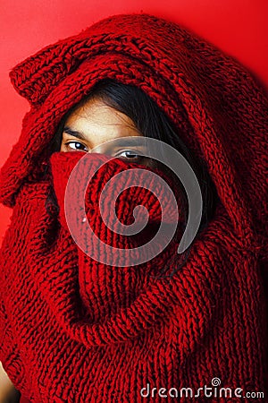 Young pretty indian girl in red sweater posing emotional close u Stock Photo