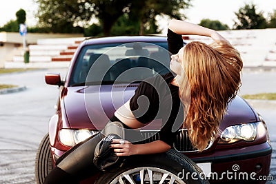 Young pretty lady with a clasic car Stock Photo