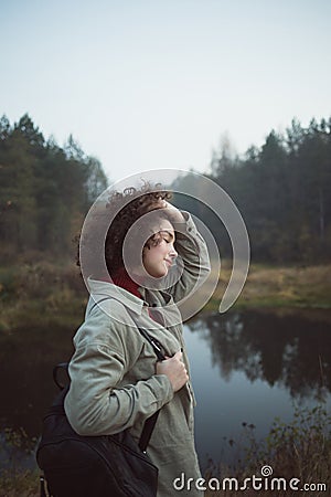 Young pretty mixed race teen girl in harmony with nature. concept of adventure, travel, and rest alone. Stock Photo