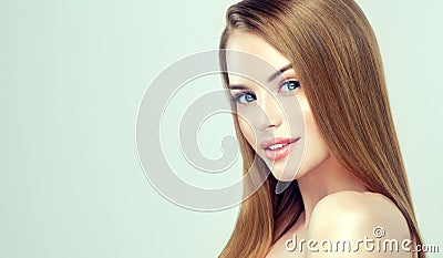 Young pretty model with straight, loose hairstyle on the head.Hairdressing, cosmetology, and beauty technologies. Stock Photo