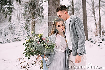 Young pretty pair of lovers. Winter. Date. A pair of lovers on a date in the mountains. Stock Photo