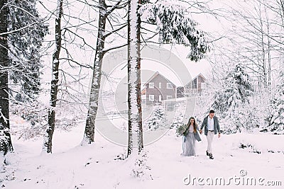 Young pretty pair of lovers. Winter. Date. A pair of lovers on a date in the mountains. Stock Photo