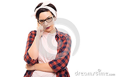 Young pretty pin-up girl wearing glasses showing thinking gesture. Stock Photo