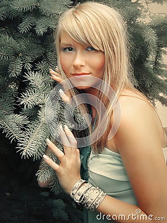 Young pretty / woman and a Christmas tree Stock Photo