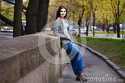 Young pretty stylish smiling woman wearing fashionable shortened Stock Photo