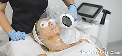 young pretty woman having nonsurgical face lifting procedure at the salon, facial and beauty treatment concept Stock Photo